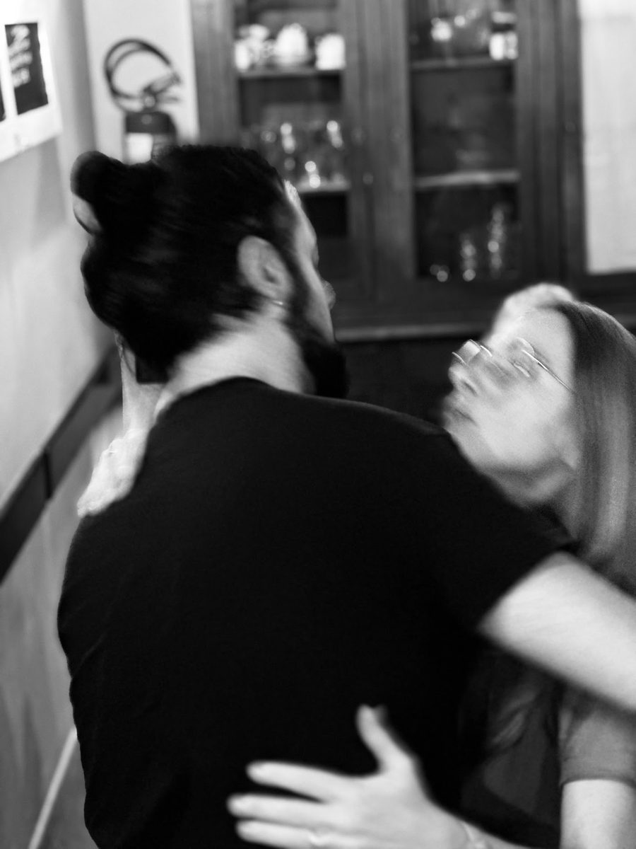Two team members hugging during a break