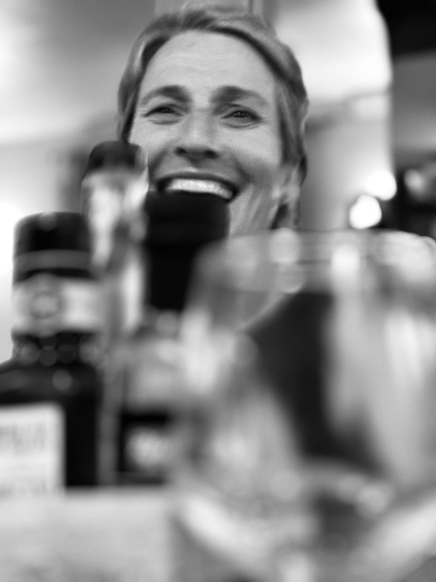 A team member laughing during dinner