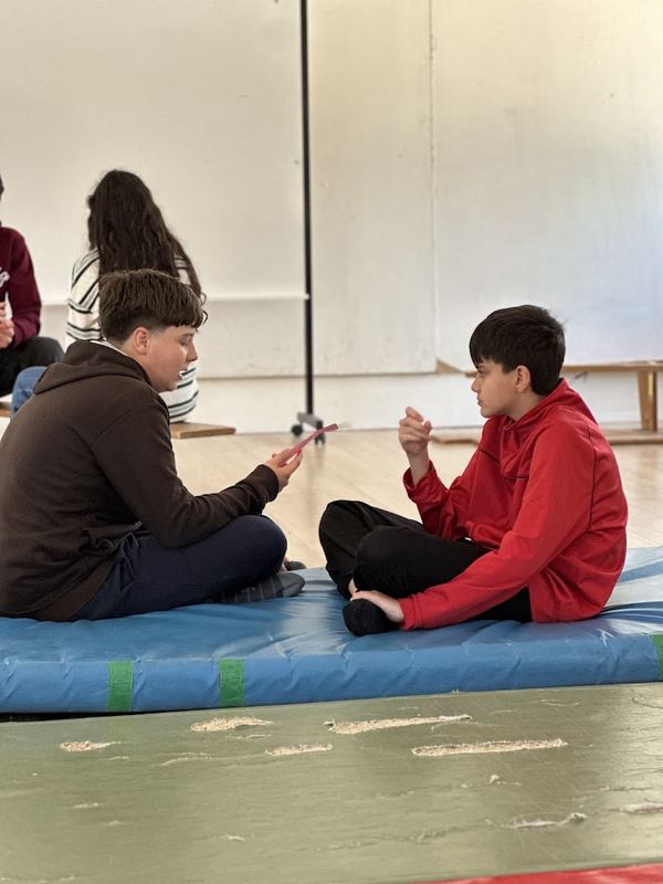 Young people testing the cards on mats during a piloting session
