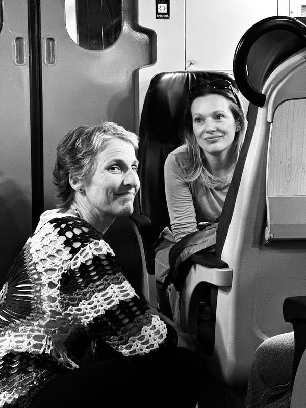 Two team members laughing in the van