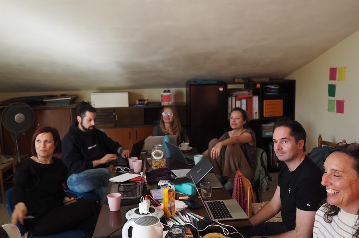 The team working together on laptops during a partner meeting