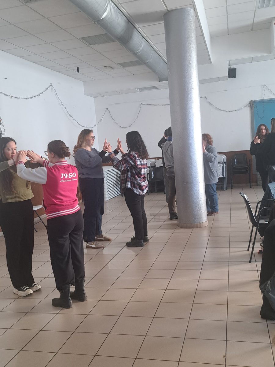 Participants standing in a circle during a group activity